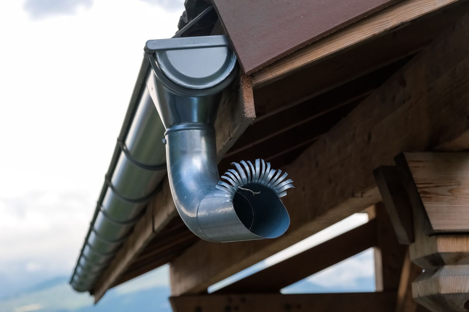 Downspout and drainage elbow on a Richmond area house